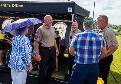 members of the culpeper county sheriff's office chat with visitors t0 the festival.jpeg